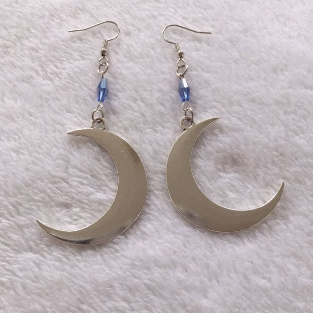 Large dangly silver toned crescent moon earrings